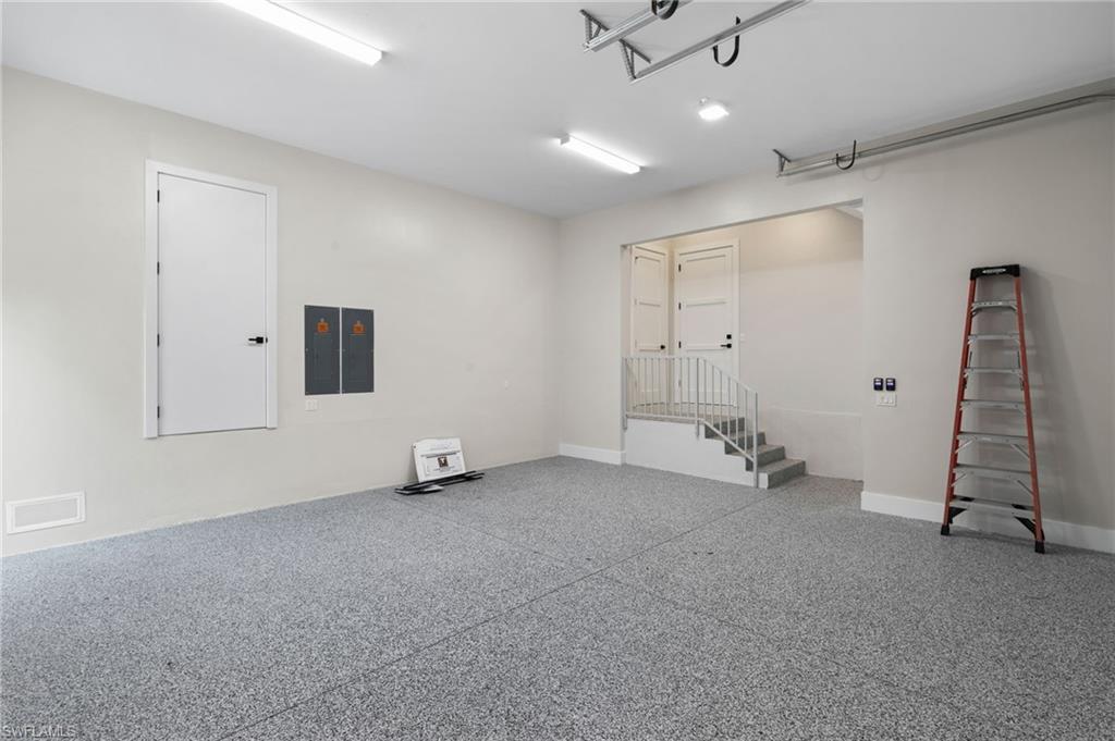 1191 7th Avenue North Naples, FL 34102 - Photo 48 of 49 Large Garage with 3 Storage Closets. 1 for HVAC, 1 atop the stairs for personal items, 1 Huge Closet behind the ladder wall for Storage