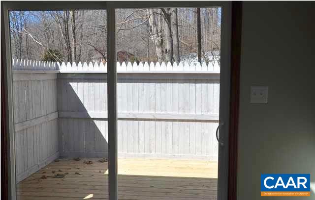 5630 Fitzgerald Road Charlottesville, VA 22903 - Photo 15 of 28 a view of an empty room with wooden floor and a window