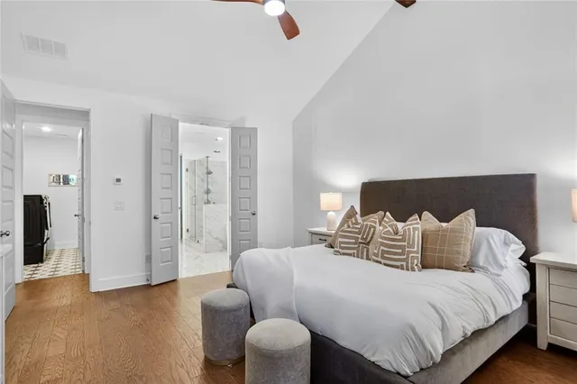 a bedroom with a bed and a couch