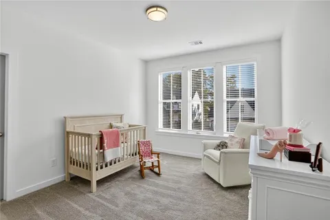 a bedroom with furniture and a window