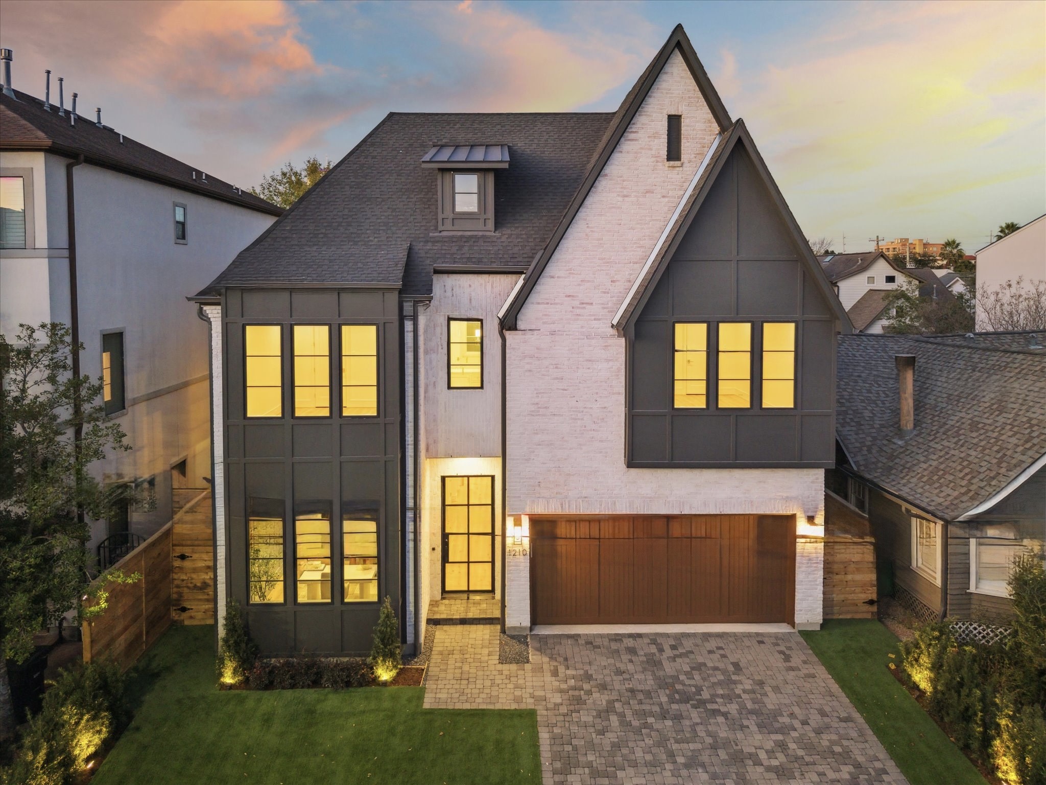1210 West Drew Street Houston, TX 77006 - Photo 1 of 35 Stunning new construction in Montrose, minutes away from endless food and fun. Slurry-coated brick encases the exterior of the home in elegance, along with a plethora of windows. The property features a large, two-car garage and plenty of guest parking on the pavered drive.