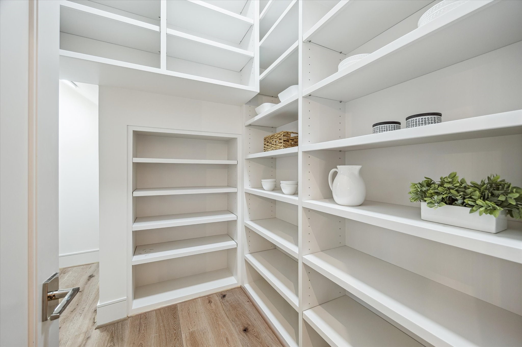 1210 West Drew Street Houston, TX 77006 - Photo 19 of 35 The spacious walk-in pantry. There’s plenty of space in the front for every day use items, and it continues to the left with additional shelving, and behind for longer term storage under the stairs. So much room!