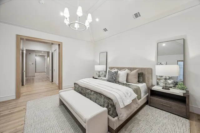 a spacious bathroom with double vanity a mirror a vanity and a bathtub