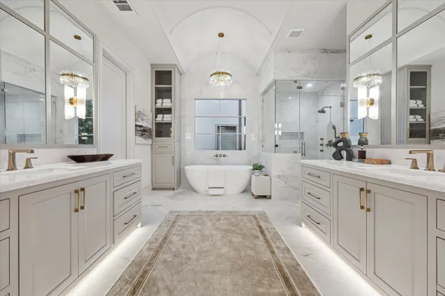a bathroom with a bathtub and a shower