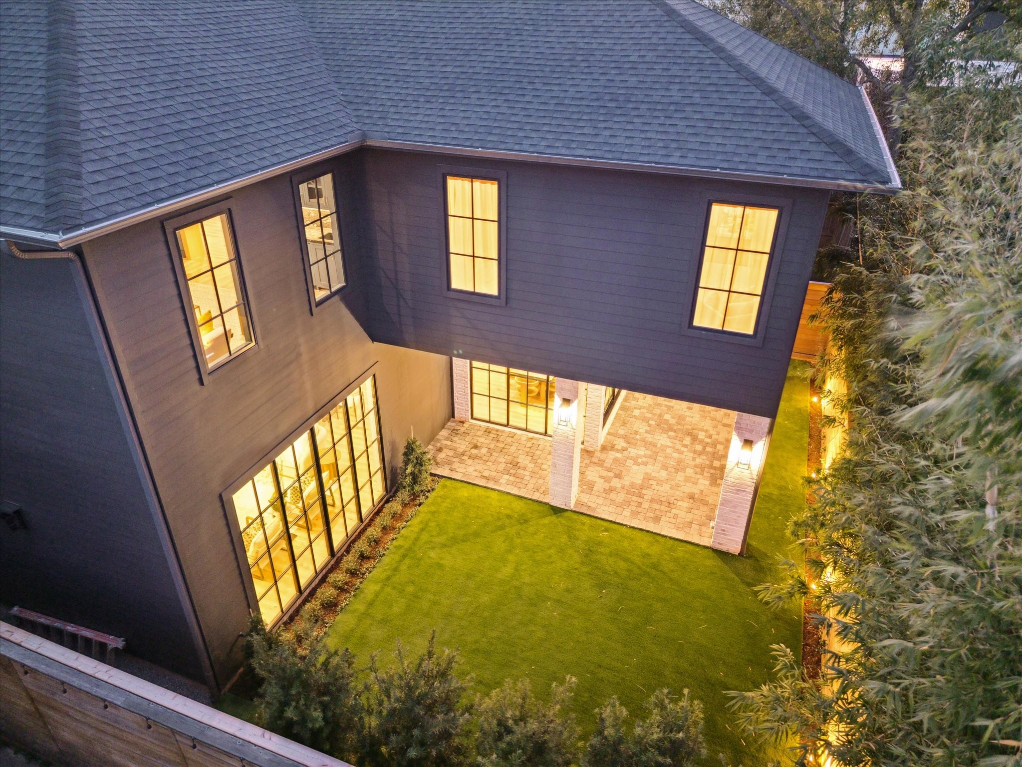 1210 West Drew Street Houston, TX 77006 - Photo 33 of 35 An aerial view of the rear of the home shows the great space, surrounding landscaping, and low-maintenance artificial turf. A great space for Inner-Loop living!