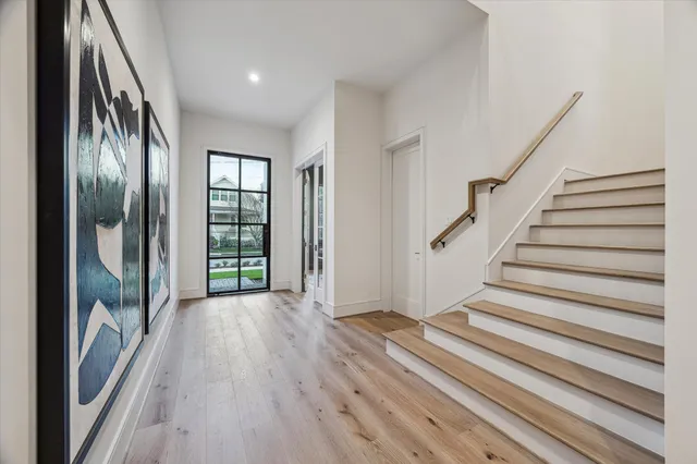 a view of entryway with wooden floor