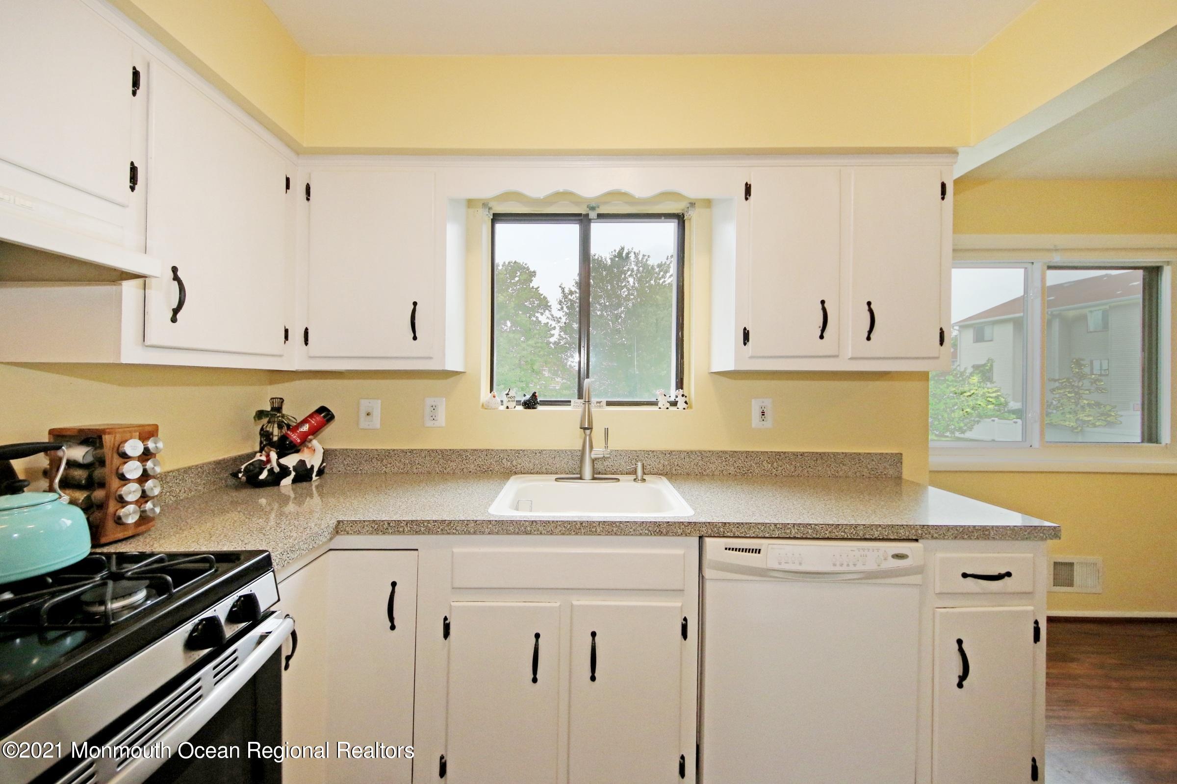 373 Middlewood Road Middletown, NJ 07748 - Photo 11 of 28 a kitchen with a sink and cabinets