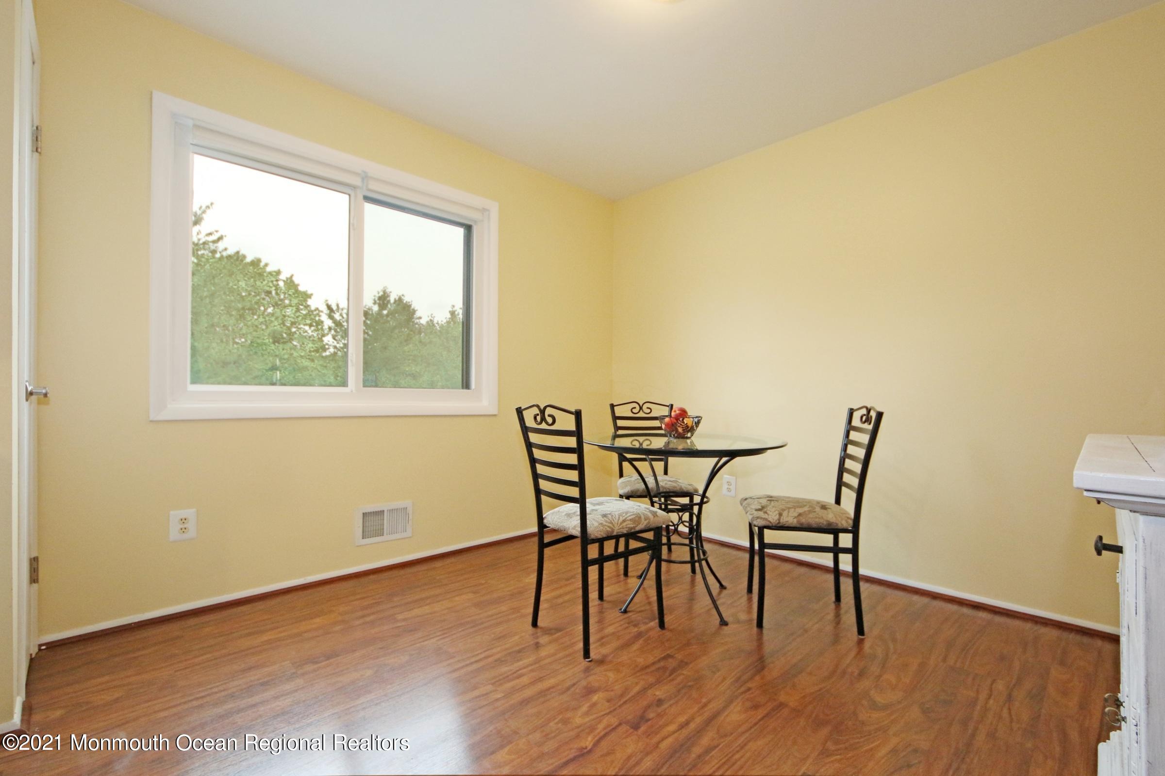 373 Middlewood Road Middletown, NJ 07748 - Photo 12 of 28 a dining room with furniture and wooden floor