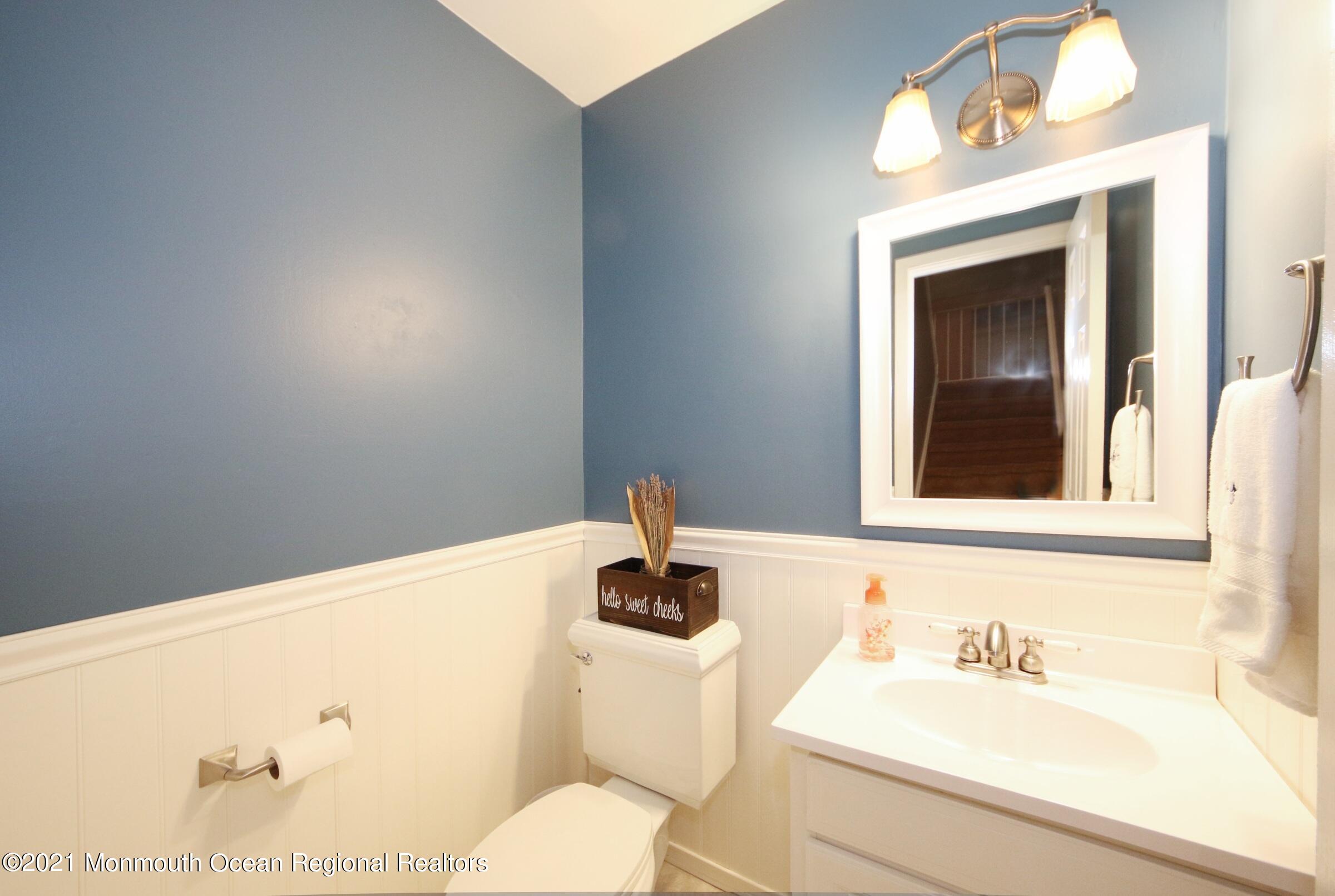 373 Middlewood Road Middletown, NJ 07748 - Photo 14 of 28 a bathroom with a sink and a mirror
