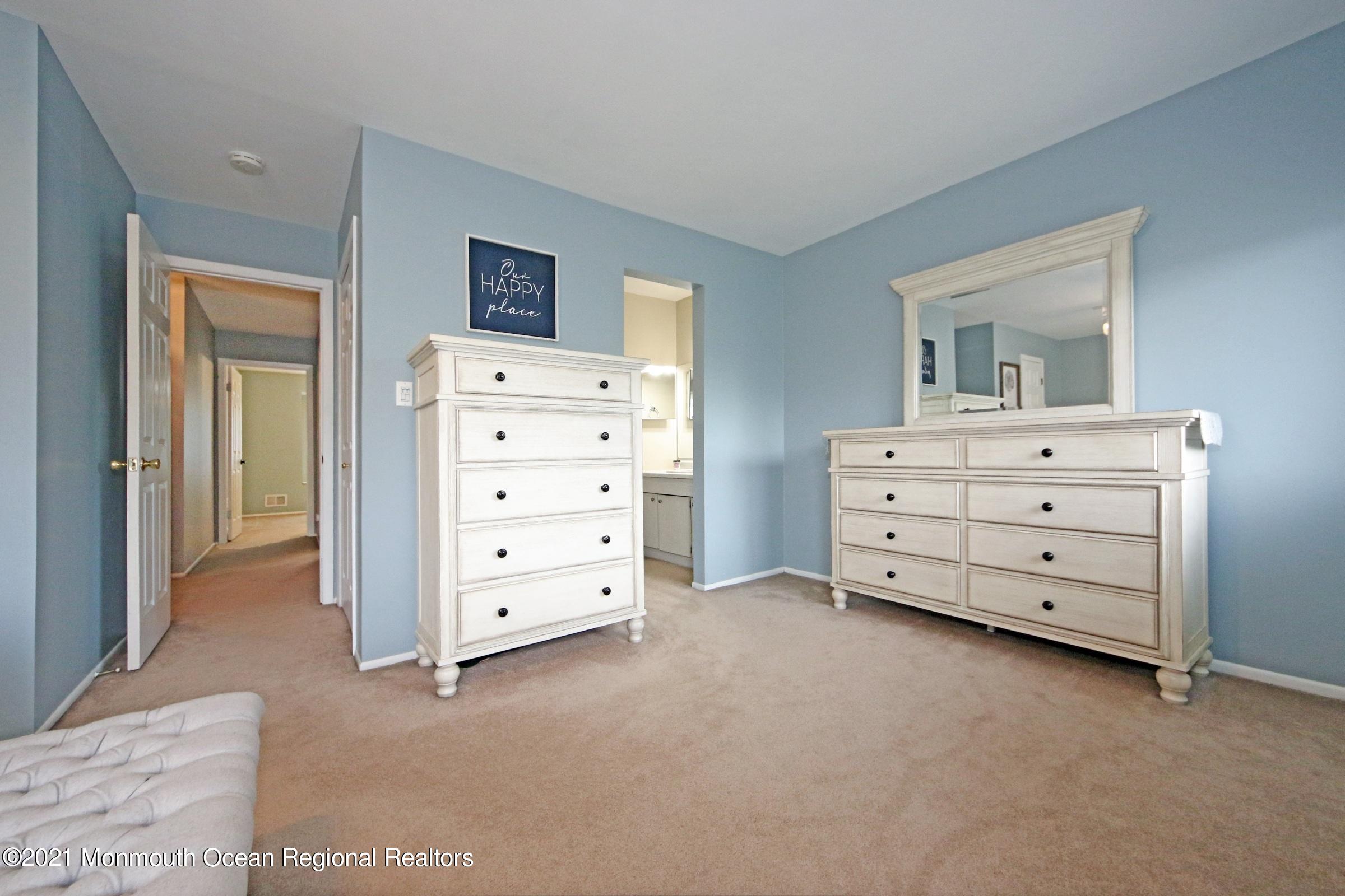 373 Middlewood Road Middletown, NJ 07748 - Photo 18 of 28 a view of room with cabinet and mirror