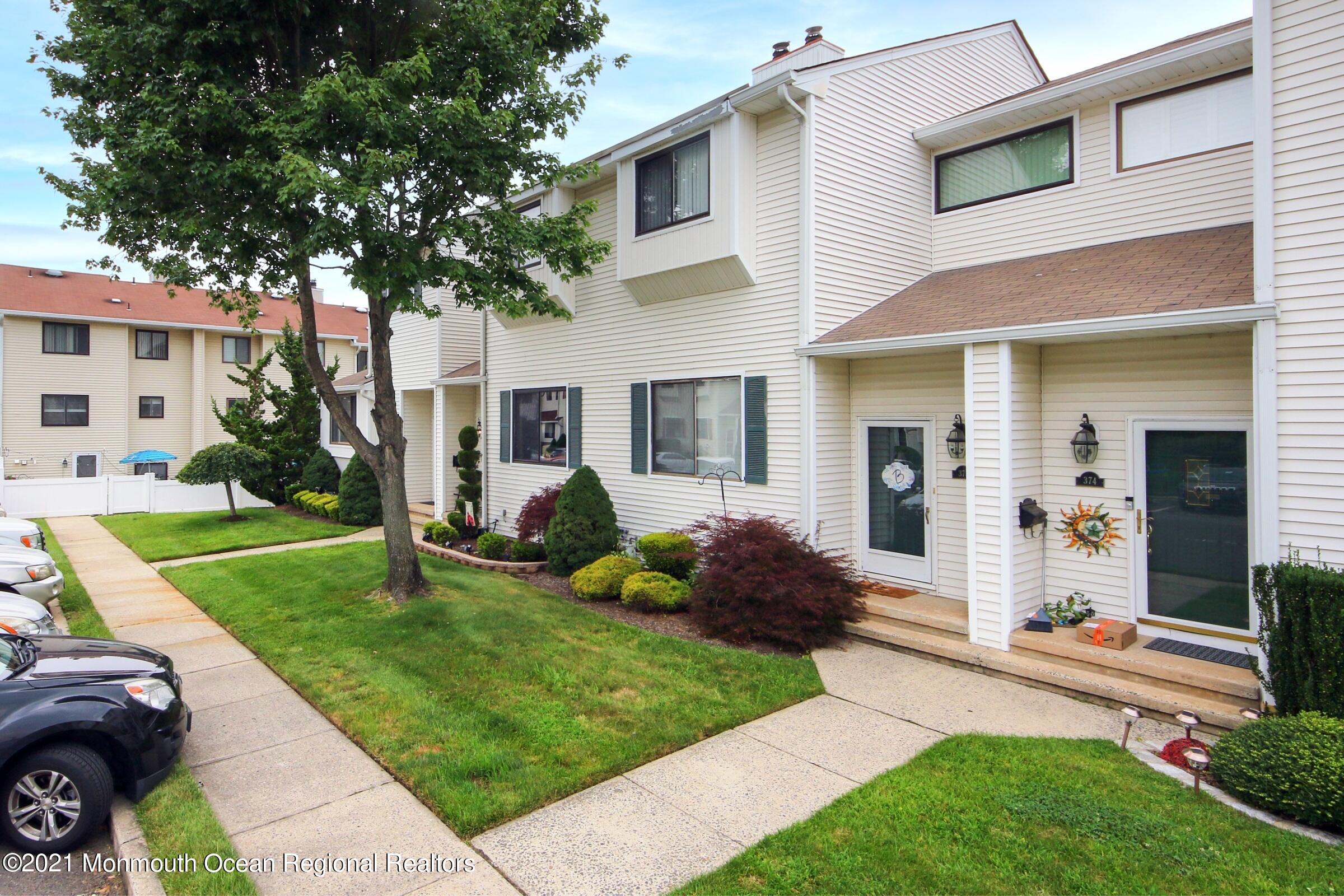 373 Middlewood Road Middletown, NJ 07748 - Photo 3 of 28 a front view of a house with a yard