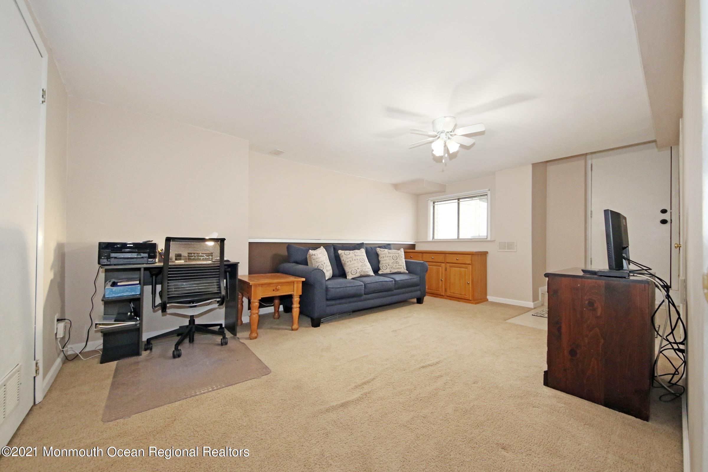 373 Middlewood Road Middletown, NJ 07748 - Photo 23 of 28 a living room with furniture and a window