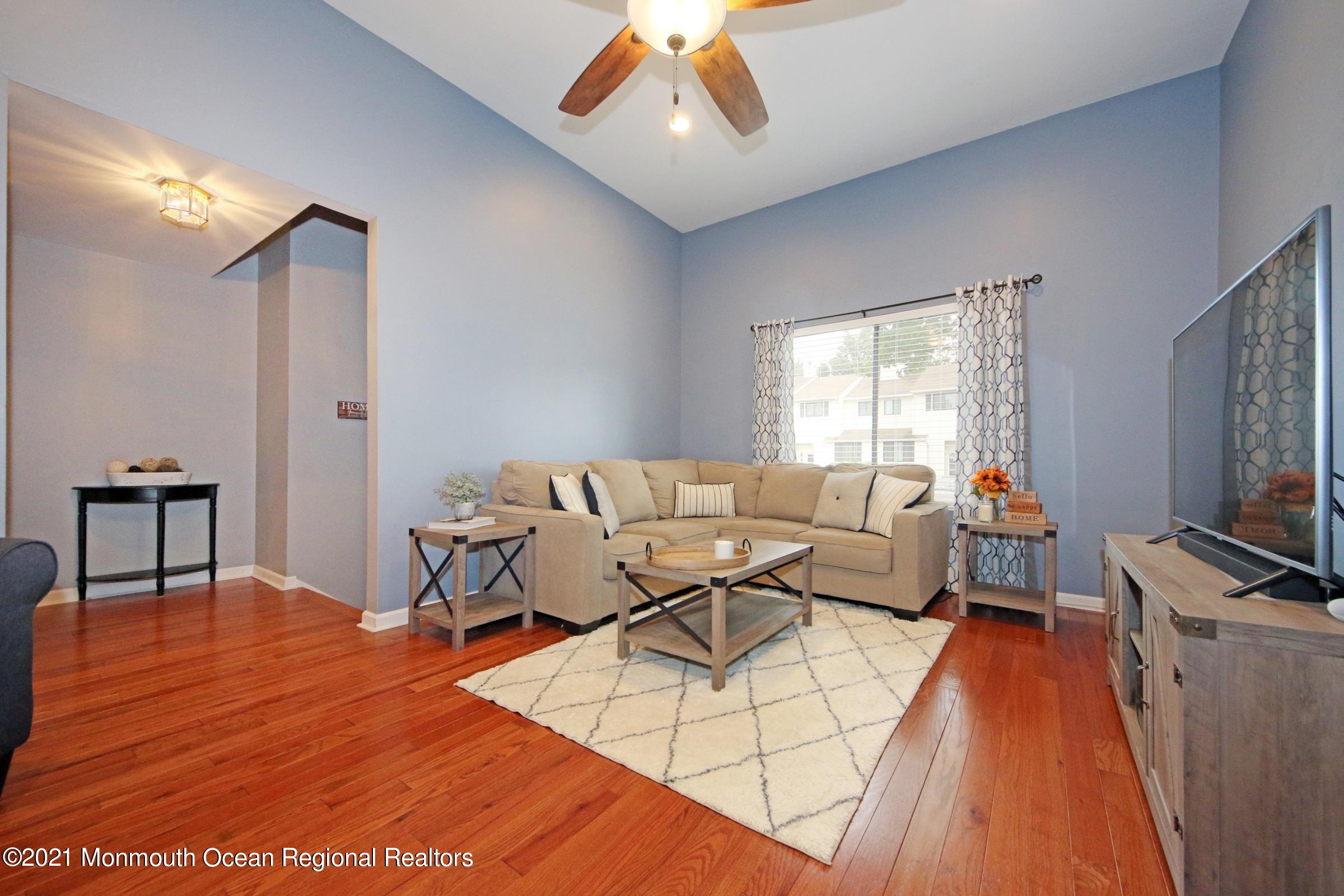 373 Middlewood Road Middletown, NJ 07748 - Photo 6 of 28 a living room with furniture and a flat screen tv