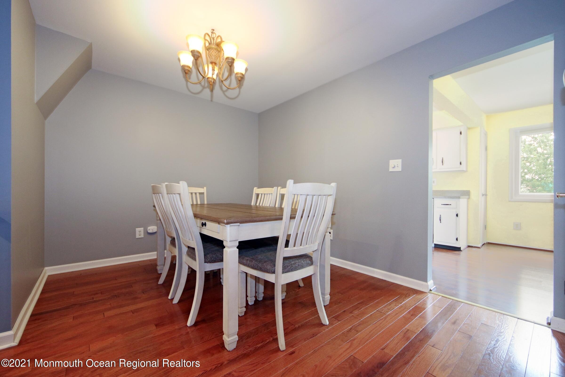 373 Middlewood Road Middletown, NJ 07748 - Photo 7 of 28 a view of a dining room with furniture and wooden floor