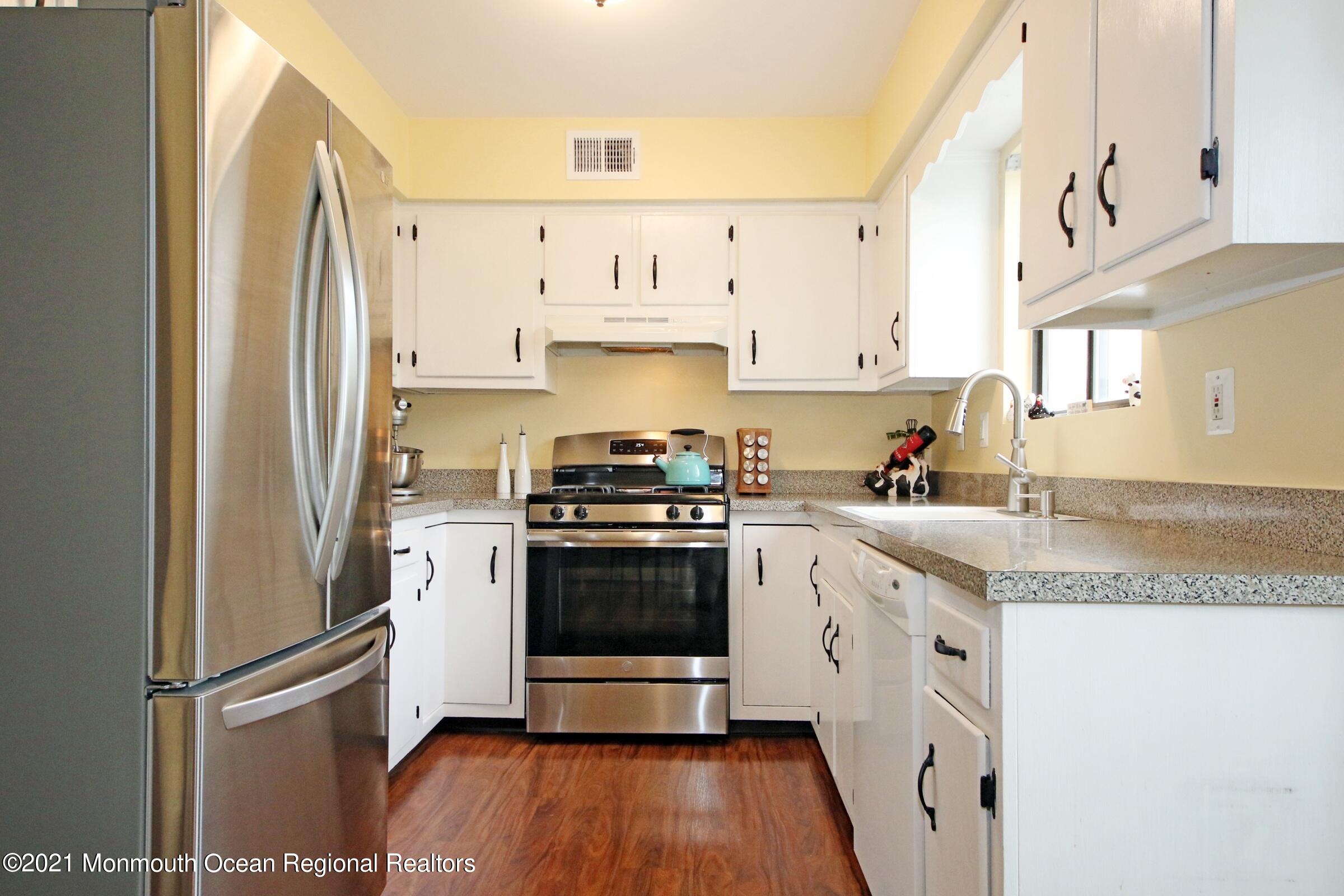 373 Middlewood Road Middletown, NJ 07748 - Photo 10 of 28 a kitchen with stainless steel appliances granite countertop a refrigerator and a stove top oven