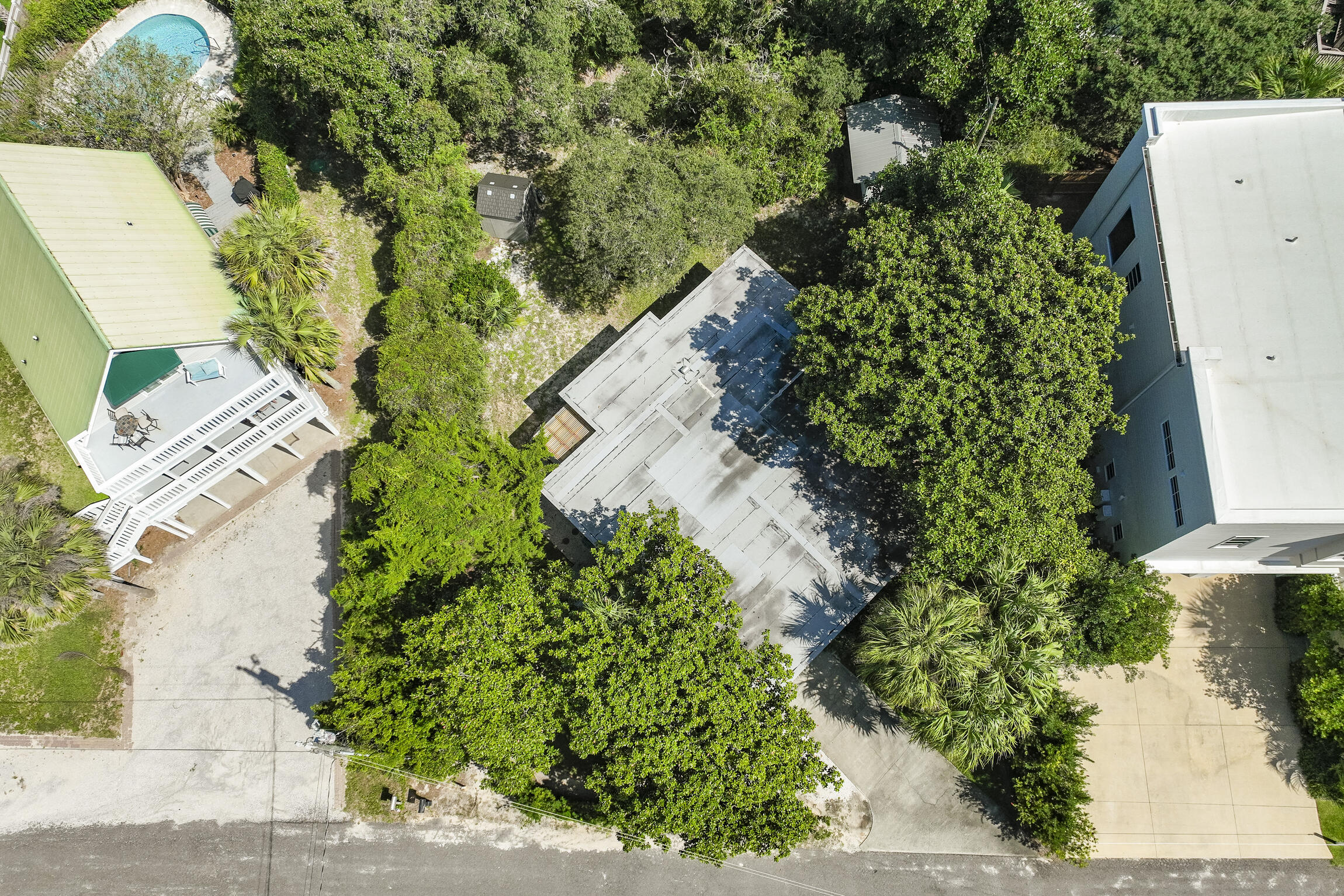 181 Gulf Point Road Santa Rosa Beach, FL 32459 - Photo 2 of 21 an aerial view of a house with a yard and garden