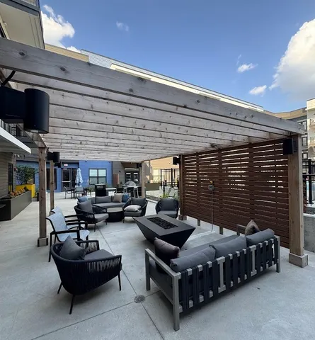 a patio view with a table and chairs