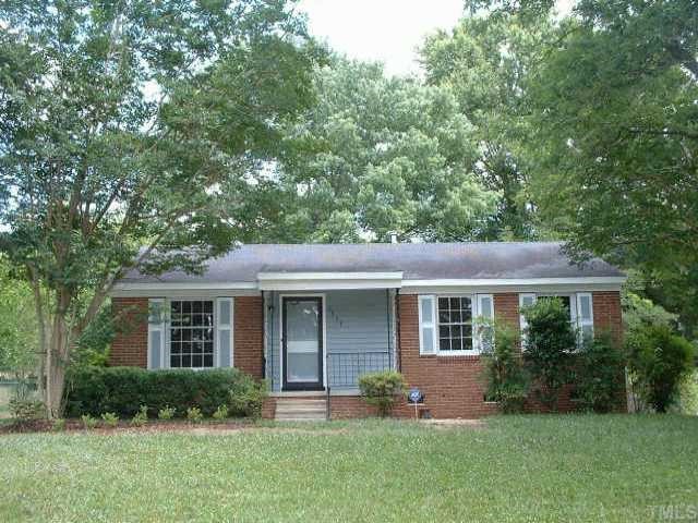 3337 Friar Tuck Road Raleigh, NC 27610 - Photo 1 of 1 a front view of a house with a yard and green space