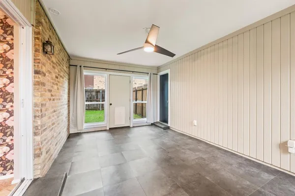 a view of a backyard with wooden floor