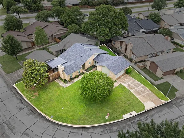 an aerial view of a house with a garden