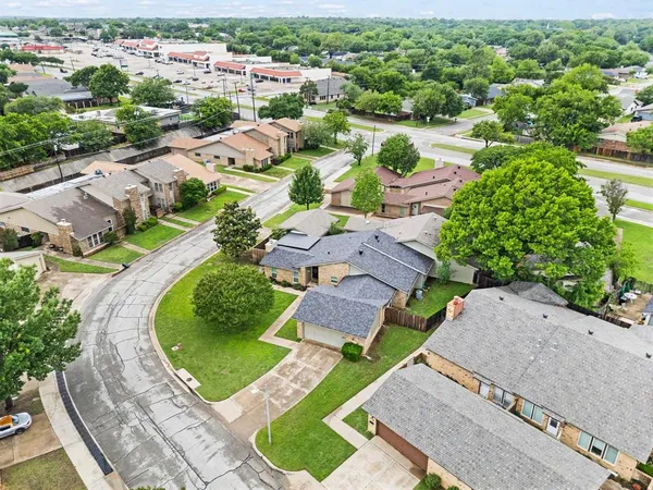 an aerial view of residential houses with outdoor space