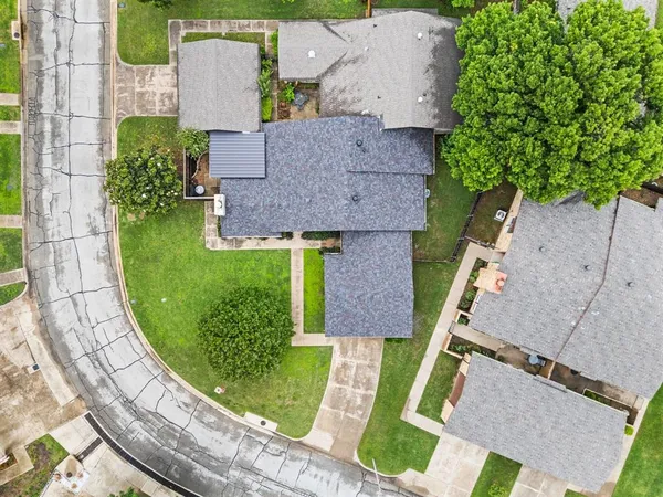 an aerial view of residential houses with outdoor space