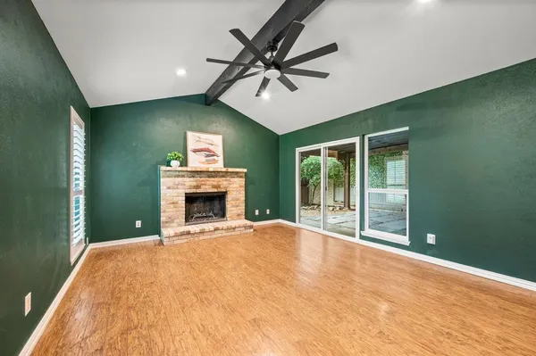 a view of a big room with windows and cabinet