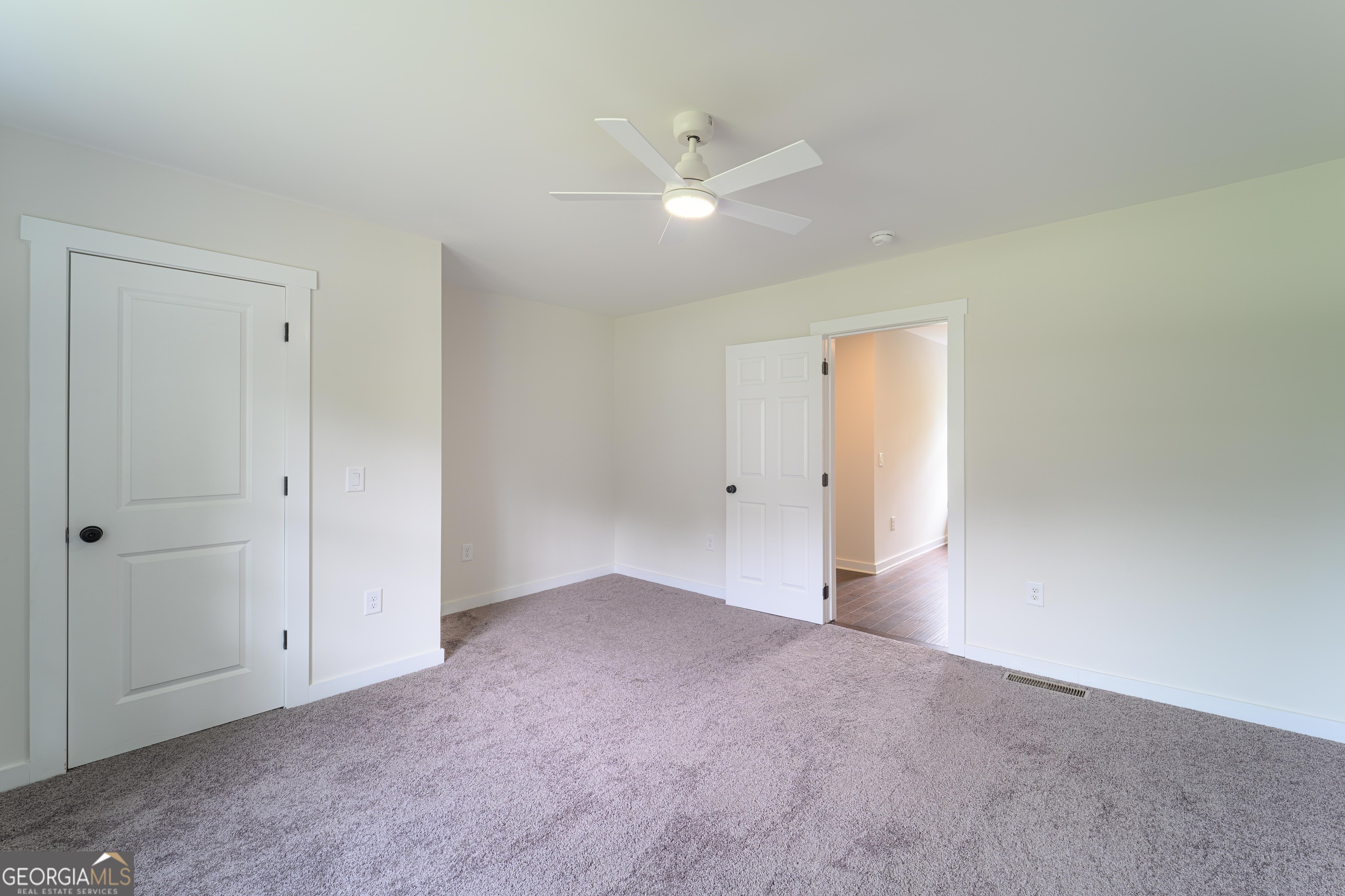 418 Lamb Road Moreland, GA 30259 - Photo 23 of 32 a view of an empty room with a ceiling fan