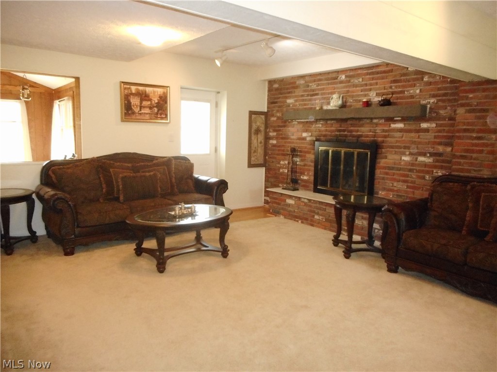 12685 Heath Road Chesterland, OH 44026 - Photo 6 of 25 Huge Family Room with One of Two Wood Burning Fireplace and a Door to the Outside Fenced Areas, Perfect for Animals, Gardens or Children! Entrance from the Garage is here Along with a Convenient Full Bath.