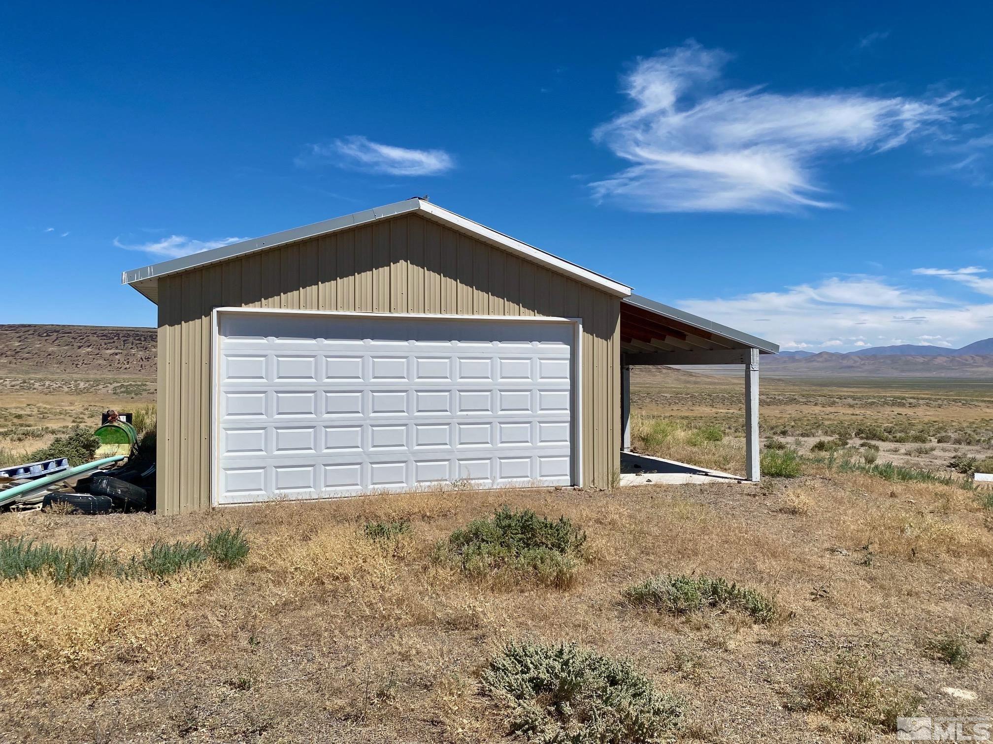 200 Transfer Site Road Crescent Valley, NV 89821 - Photo 13 of 18 a front view of a house with a yard