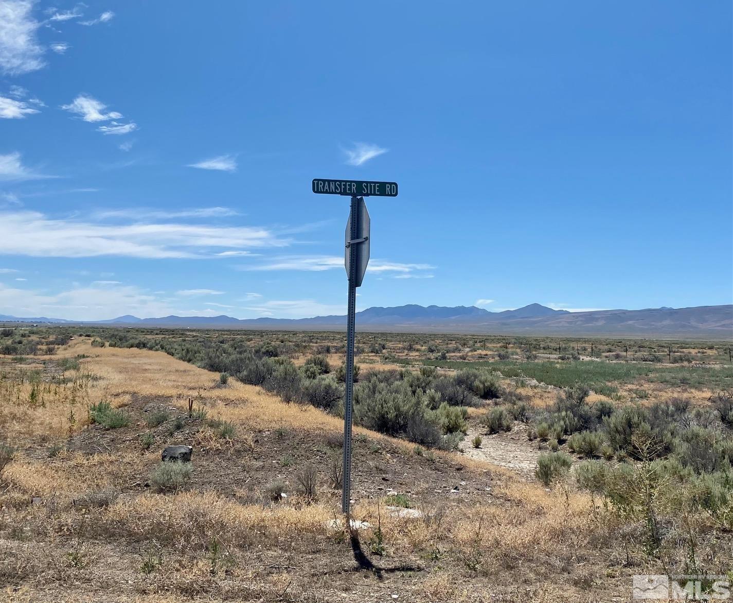 200 Transfer Site Road Crescent Valley, NV 89821 - Photo 2 of 18 a view of a lake with a mountain