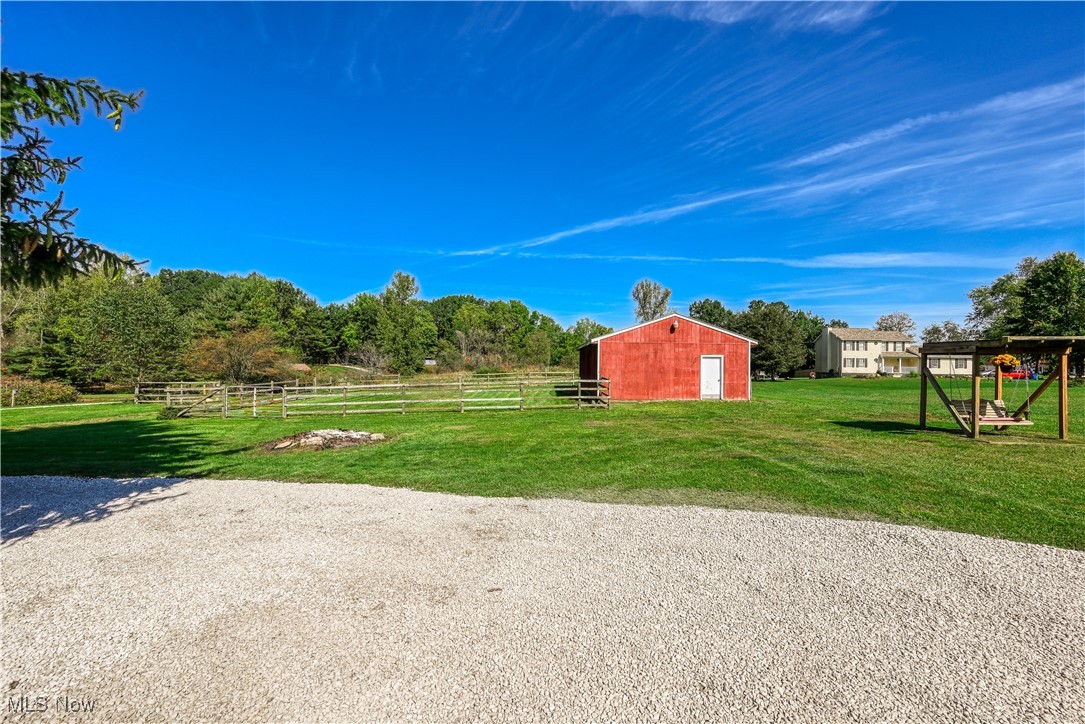 685 West Comet Road Clinton, OH 44216 - Photo 31 of 47 View of yard featuring an outbuilding and a rural view