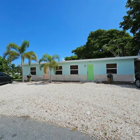 a front view of house with a yard and a garage