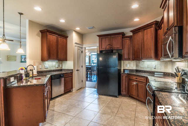471 Dover Street Fairhope, AL 36532 - Photo 9 of 29 Spacious kitchen with recessed lighting, under cabinet lighting, bead board bar surround.
