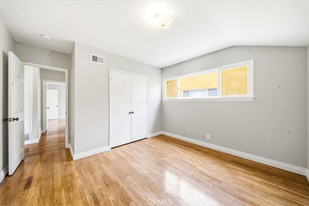6481 Dos Rios Road Downey, CA 90240 - Photo 25 of 27 a view of empty room with wooden floor