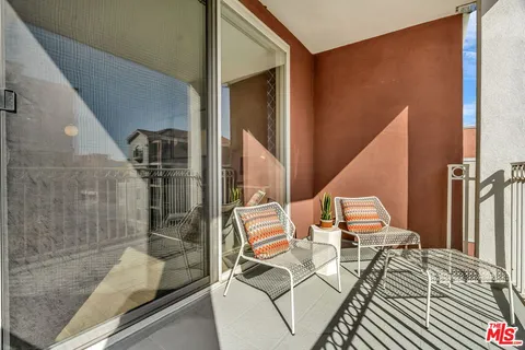 a view of a brick building from a balcony