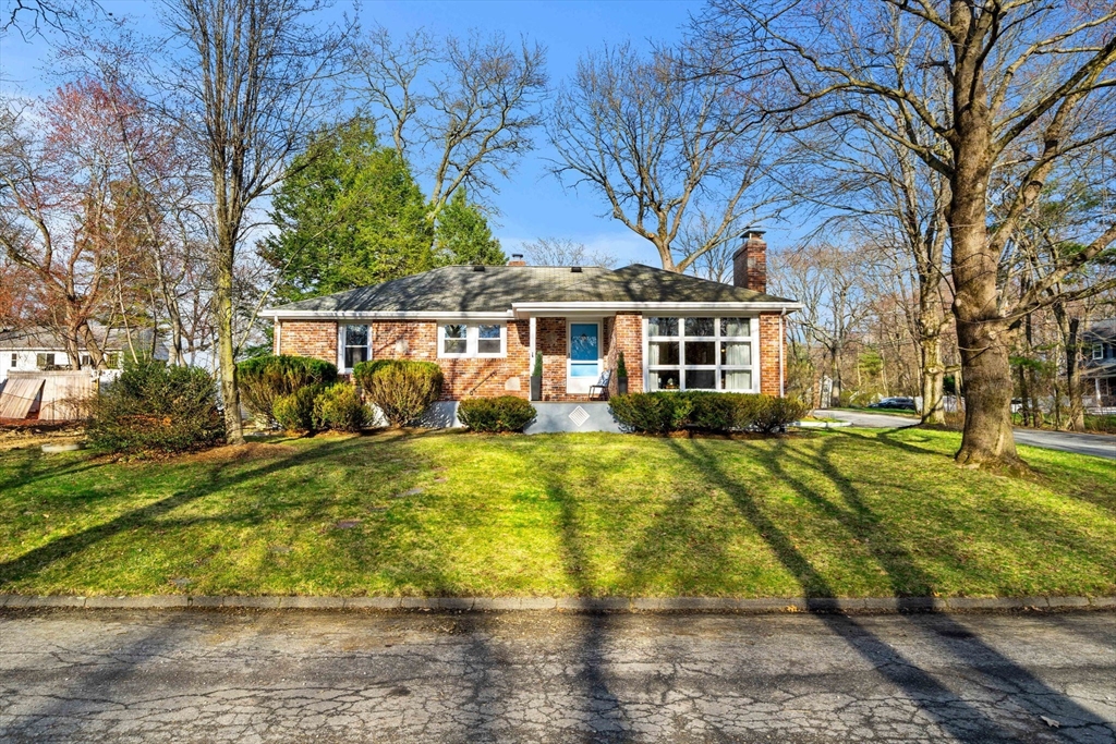 front view of a house with a yard