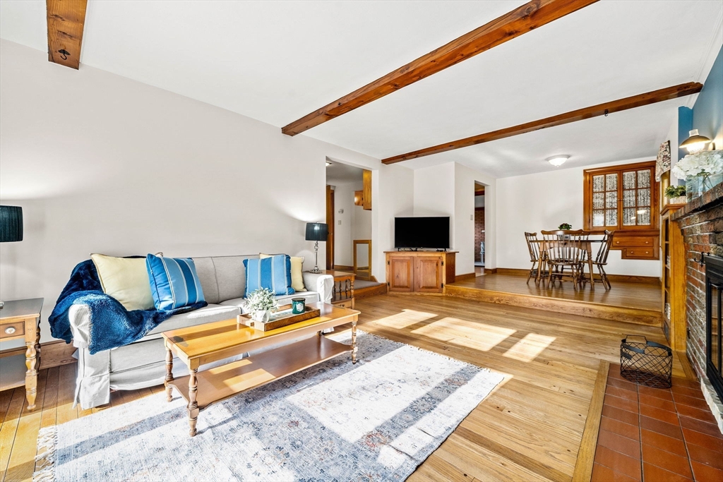 1 Ledgewood Road Wilmington, MA 01887 - Photo 12 of 36 a living room with furniture and a flat screen tv