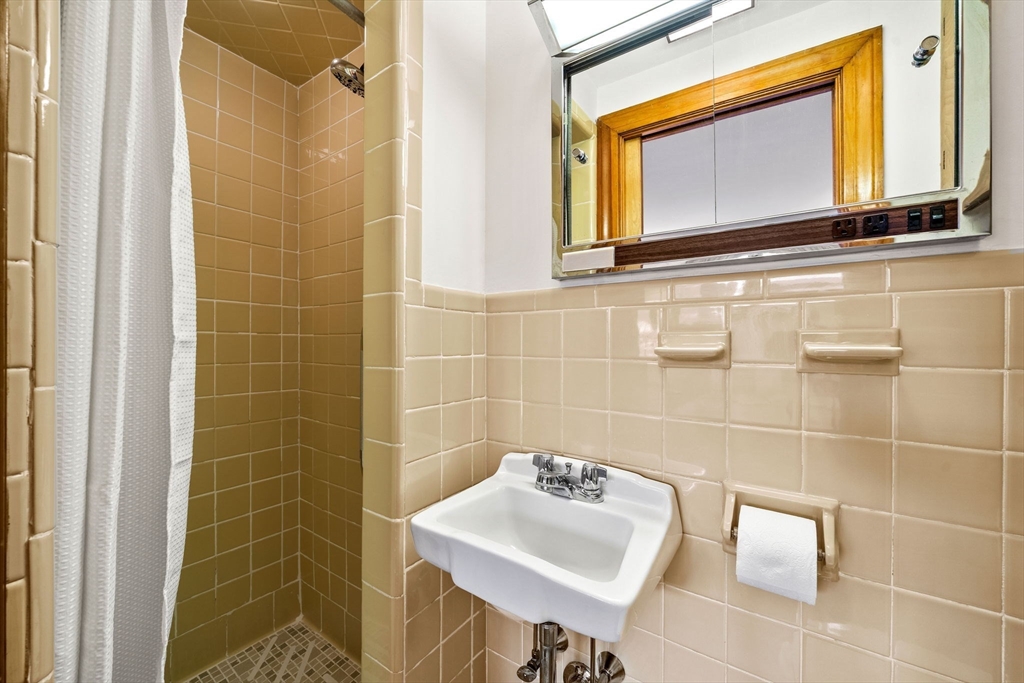 1 Ledgewood Road Wilmington, MA 01887 - Photo 19 of 36 a bathroom with a sink toilet and mirror