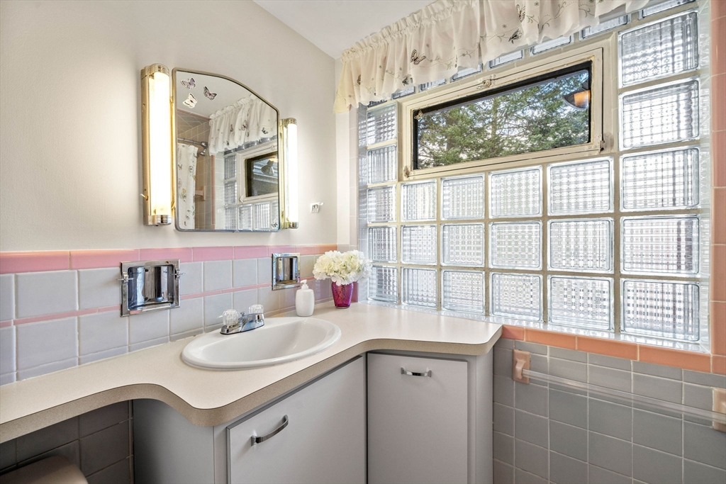 1 Ledgewood Road Wilmington, MA 01887 - Photo 20 of 36 a bathroom with a sink and a window