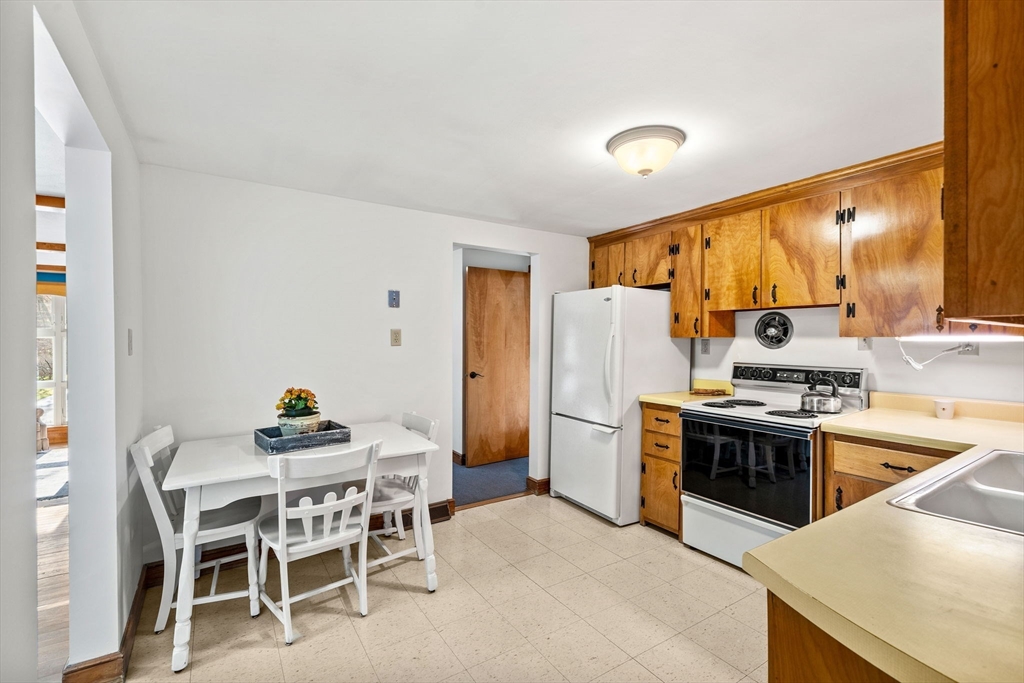 1 Ledgewood Road Wilmington, MA 01887 - Photo 4 of 36 a kitchen with stainless steel appliances a stove a sink refrigerator and a microwave