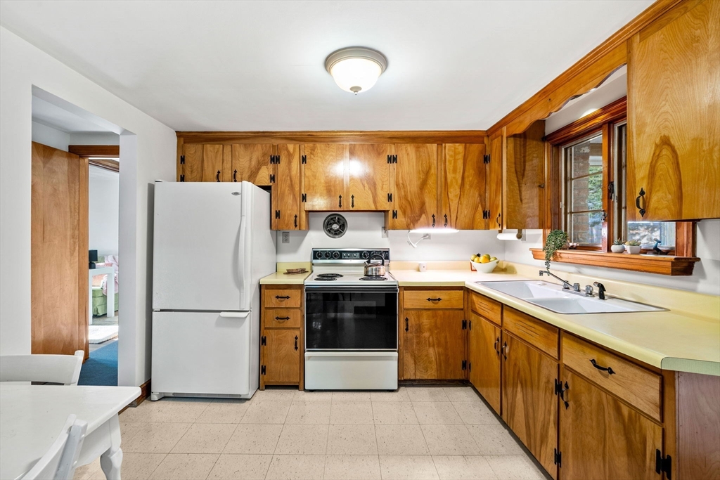 1 Ledgewood Road Wilmington, MA 01887 - Photo 5 of 36 a kitchen with stainless steel appliances a refrigerator sink and cabinets