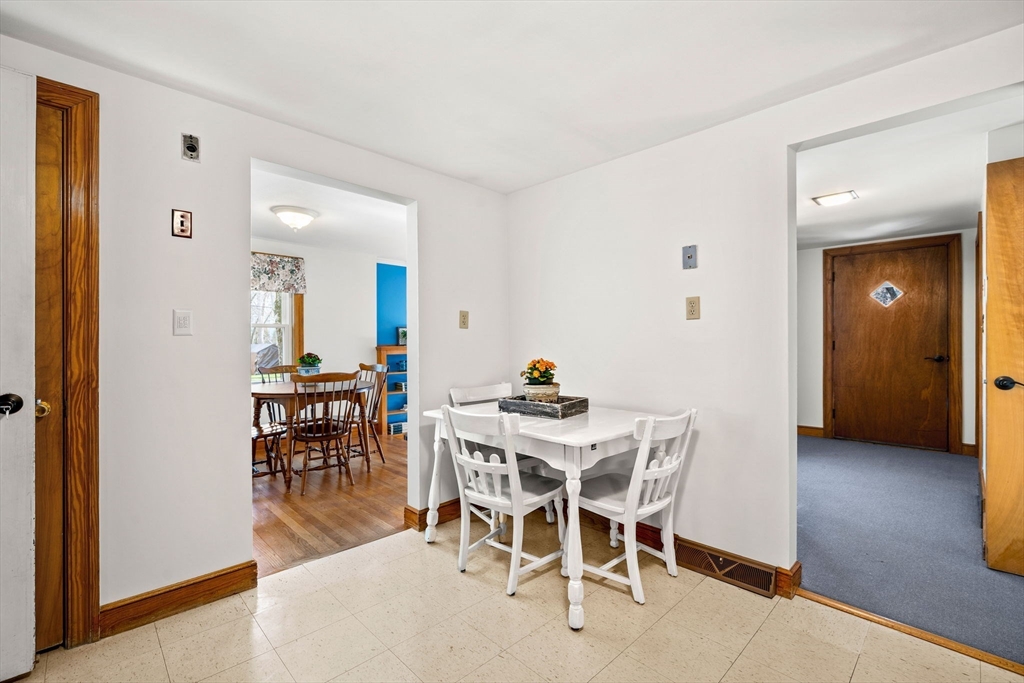 1 Ledgewood Road Wilmington, MA 01887 - Photo 7 of 36 a view of a dining room with furniture and wooden floor