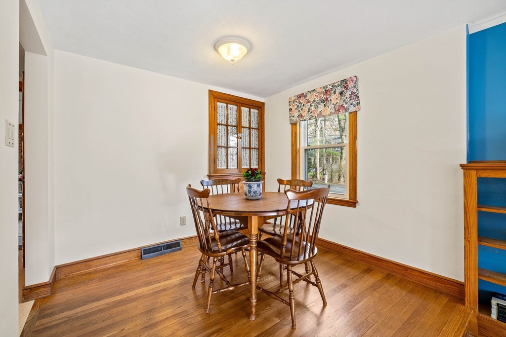 1 Ledgewood Road Wilmington, MA 01887 - Photo 9 of 36 a view of a dining room with furniture and wooden floor