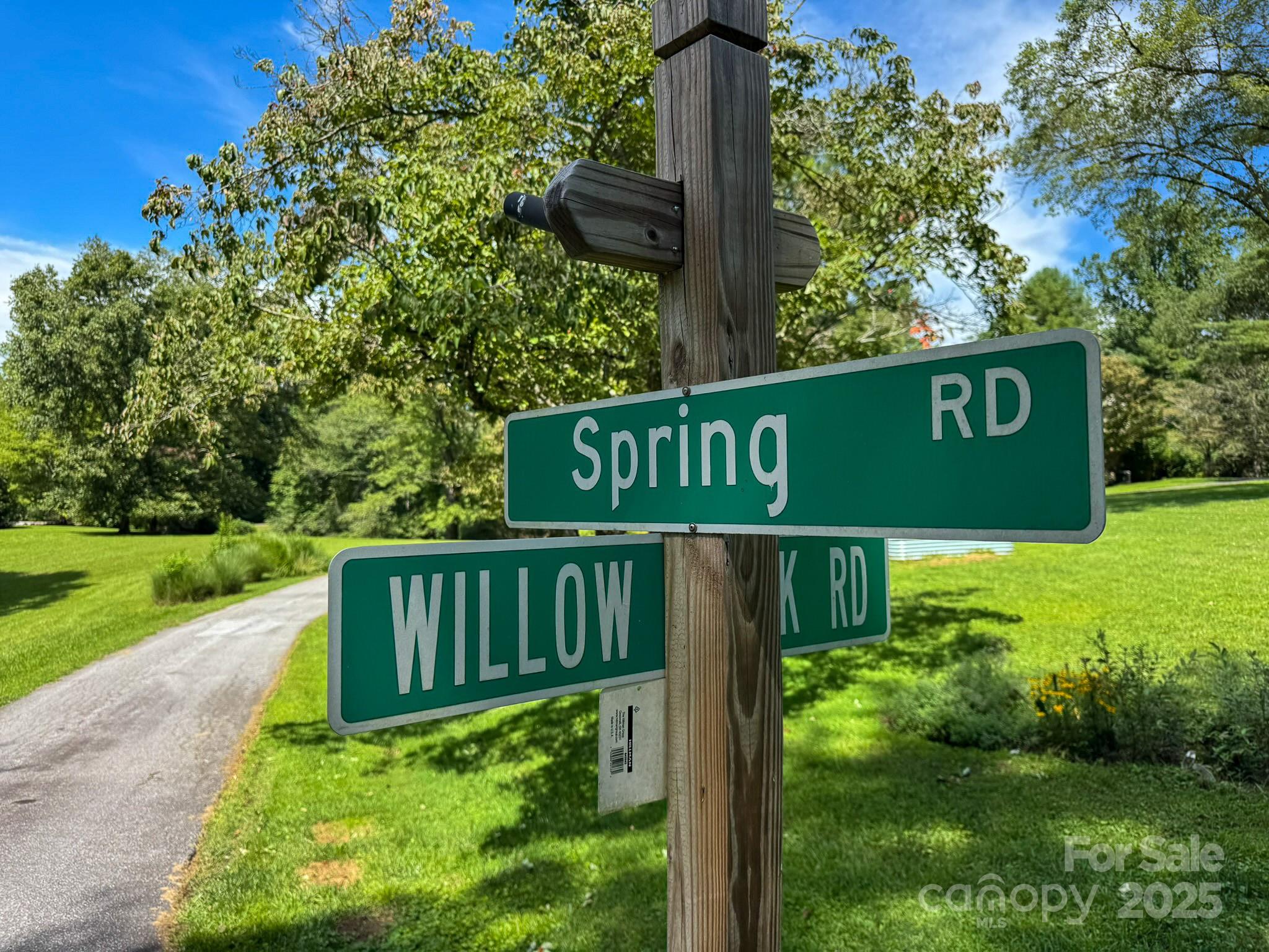 0 Spring Road, Unit 6 Hendersonville, NC 28739 - Photo 18 of 30 a view of a sign board with garden