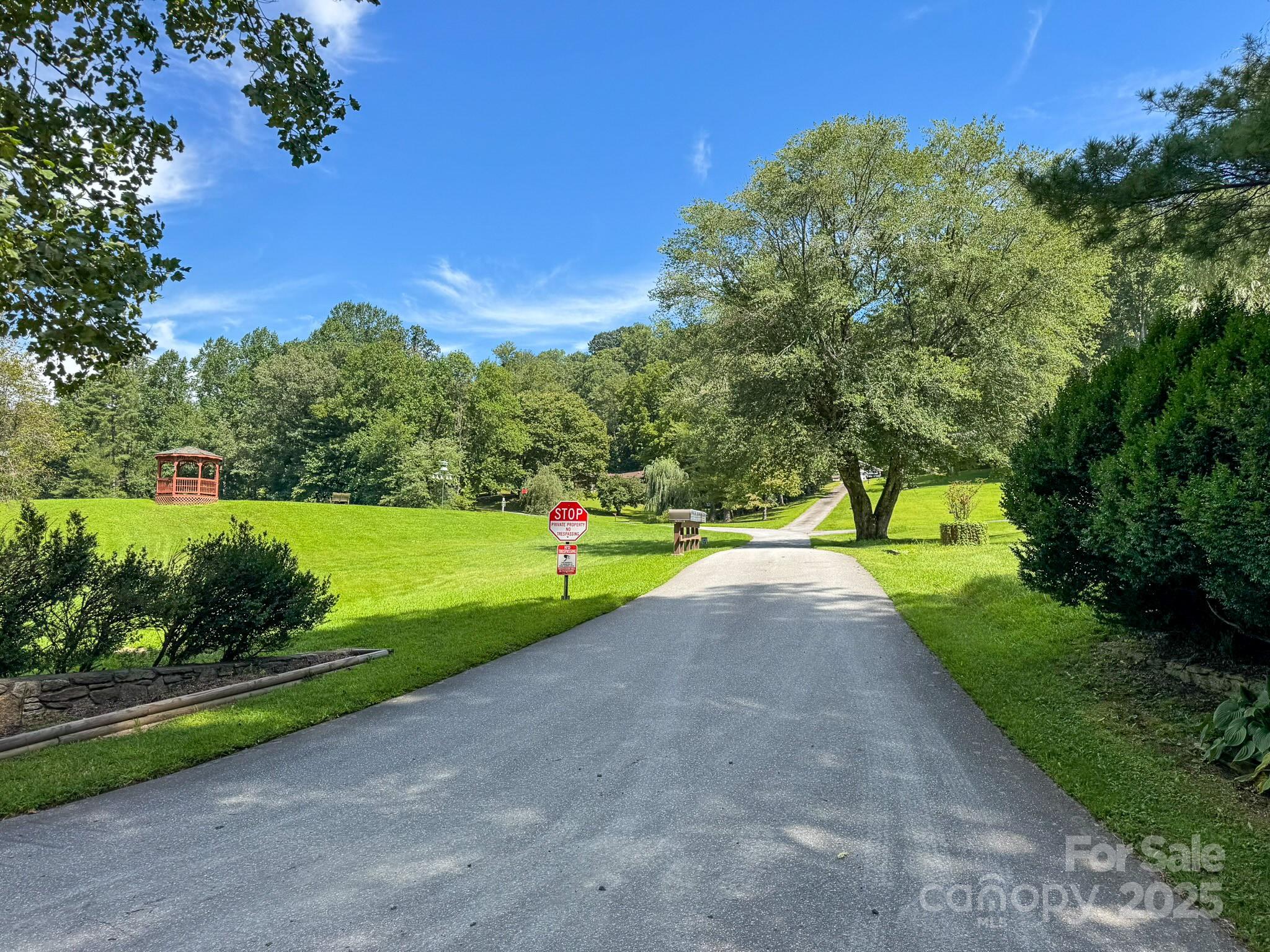 0 Spring Road, Unit 6 Hendersonville, NC 28739 - Photo 22 of 30 a view of a park with large trees