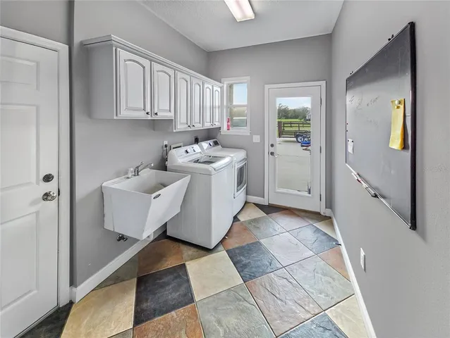 a utility room with cabinets