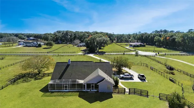 an aerial view of a house with a garden