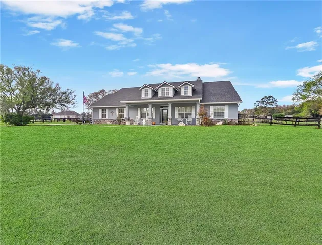 a view of a house with a big yard