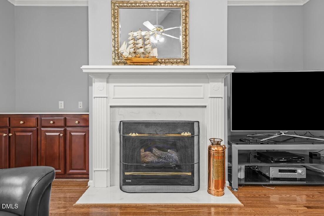 5780 McArthur Road Broadway, NC 27505 - Photo 11 of 40 a living room with furniture a flat screen tv and a fireplace